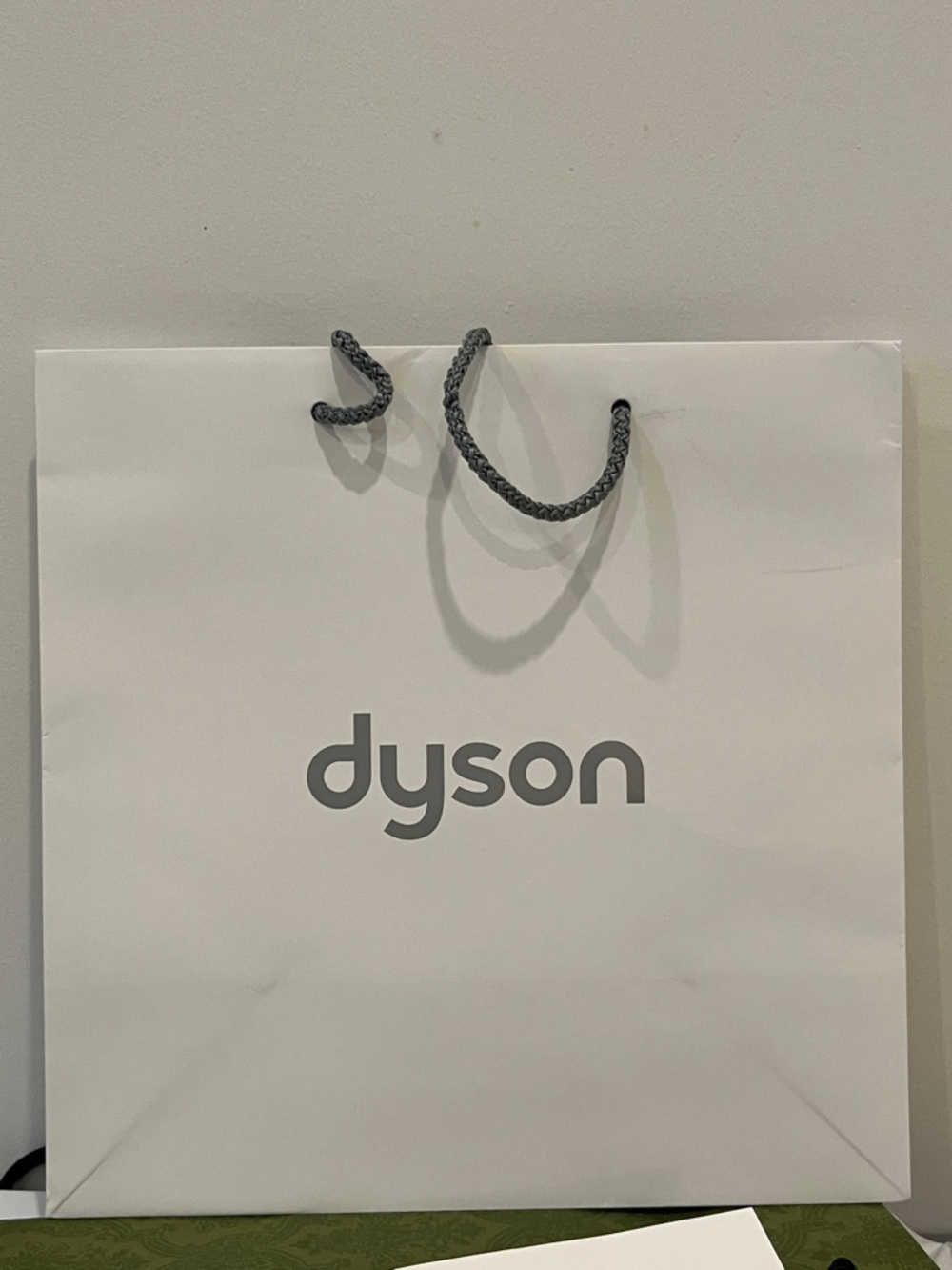 Dyson White Shopping Bag with Gray Logo and Braided Handles